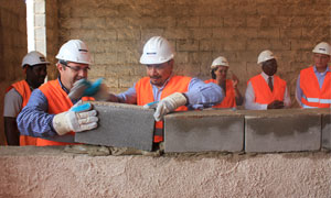 Laying the bricks of Nestlé's first factory in Angola