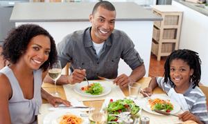 Family eating a healthy meal around the table