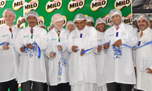 Nestlé management cutting ribbon at the opening event