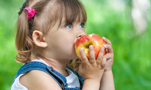 Girl eating apple