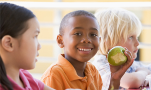 Boy eating apple