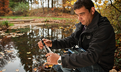 man measuring water quality