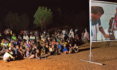 a soap opera projected onto a screen