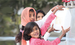 girls getting drinking water