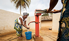woman pumping water