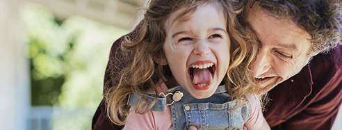 Dad and daughter playing