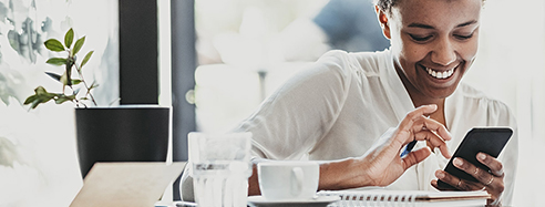 Smiling girl texting