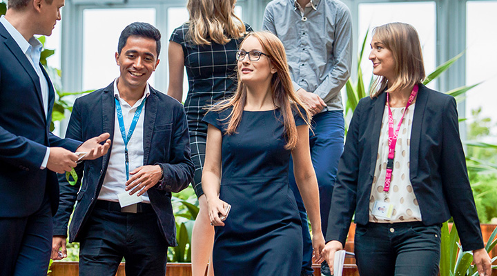 Group of employees walking in the office