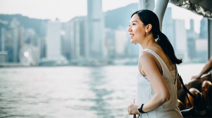 Young woman looking at a river