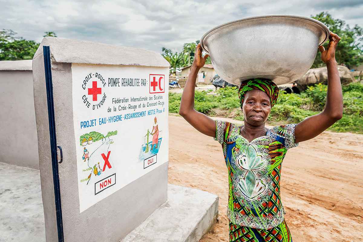 African woman carrying water