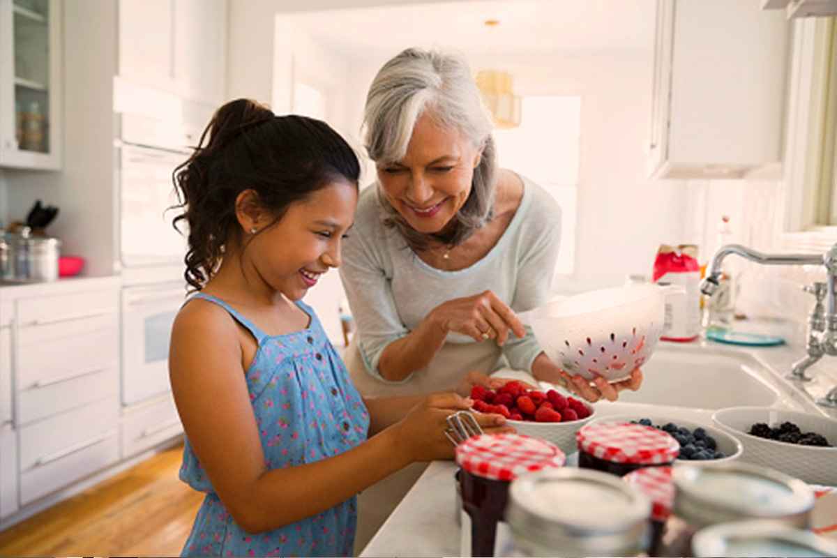 Grandma cooking with granddaughter