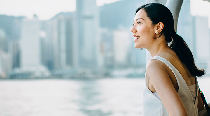 Young woman looking at a river