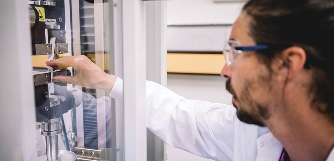 scientist checking machine
