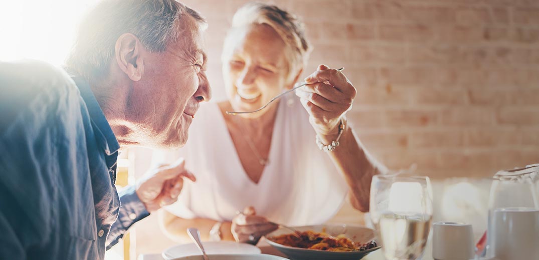 Elder couple having breakfast