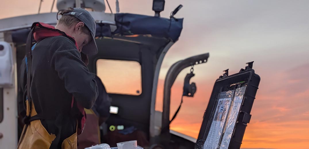 A man is making some technical settings on the boat