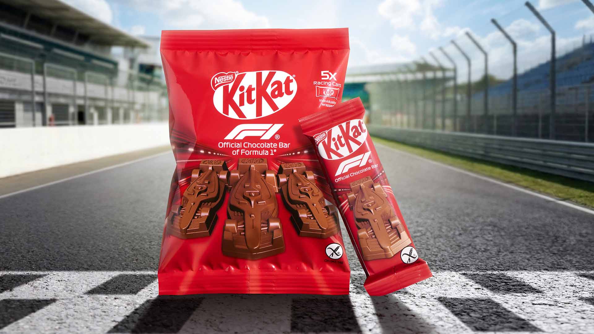 KitKat racing edition chocolate pack displayed on a racetrack finish line