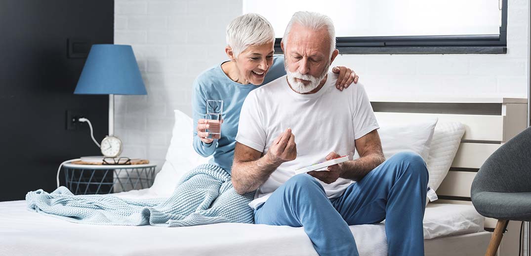 Elderly couple taking medication