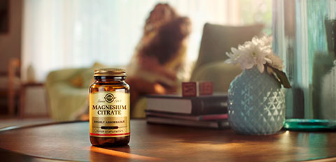 Magnesium citrate supplement bottle on a living room table