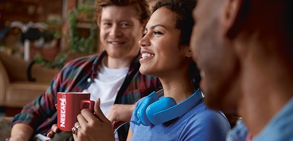 young people drinking Nescafé