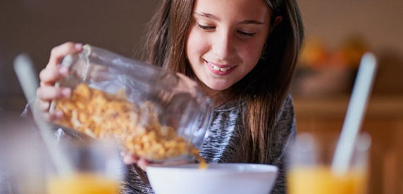 girl eating breakfast cereal