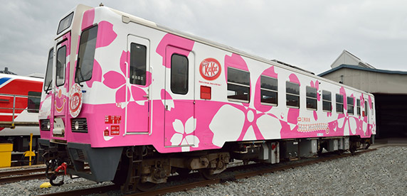 train decorated in cherry blossoms and KitKat logo train decorated in cherry blossoms and KitKat logo