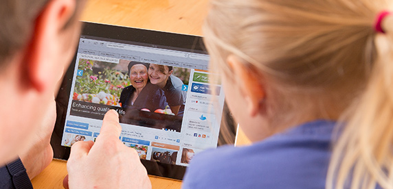 man reading Nestlé news on tablet man reading Nestlé news on tablet