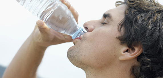 man drinking water