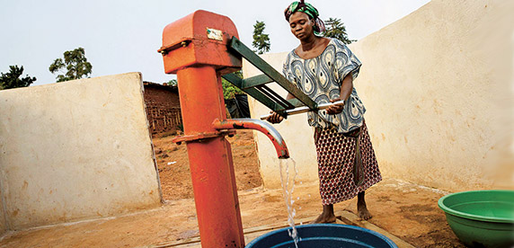 woman pumping water