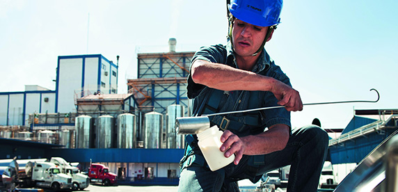 employee taking a sample