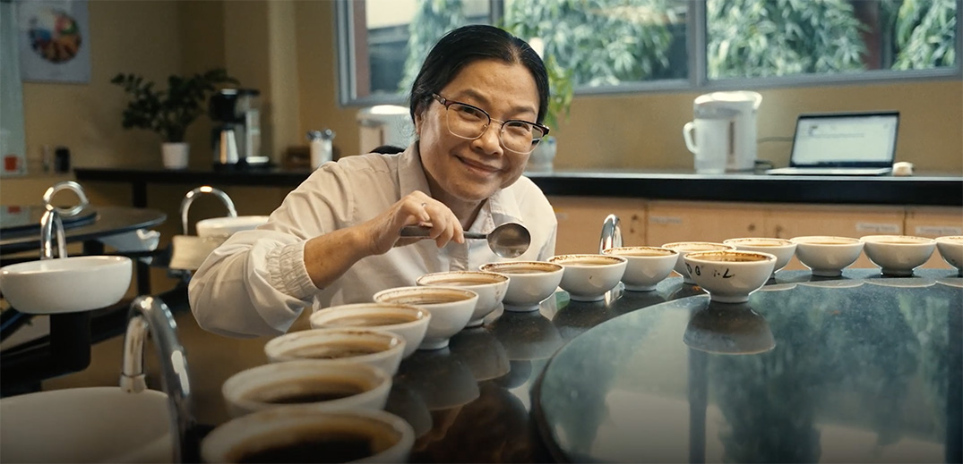 Coffee quality specialist evaluating coffee samples during a professional cupping session