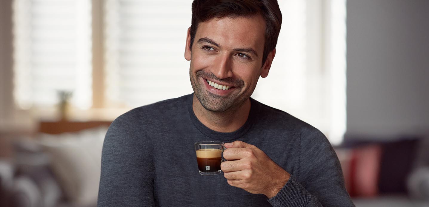 Man having Nespresso