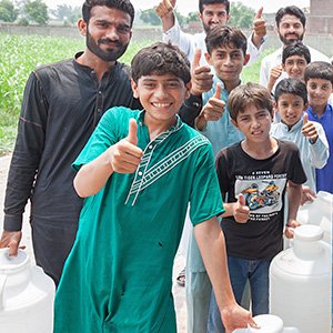 group of men getting water group of men getting water