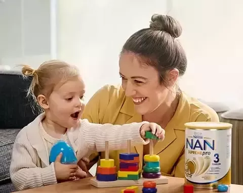 Mother and daughter playing