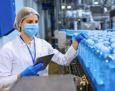 Woman checking water bottles