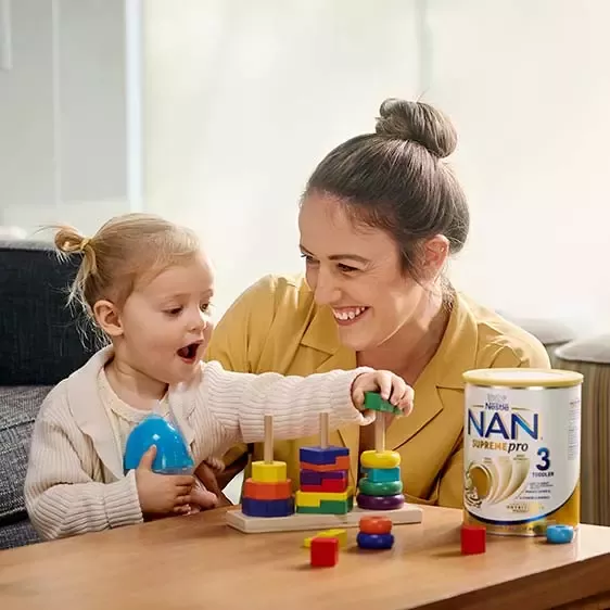 Woman playing with child
