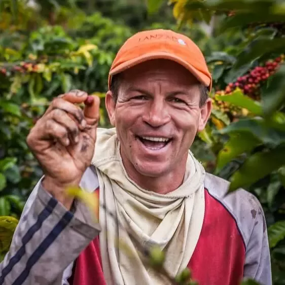 man holding coffee bean