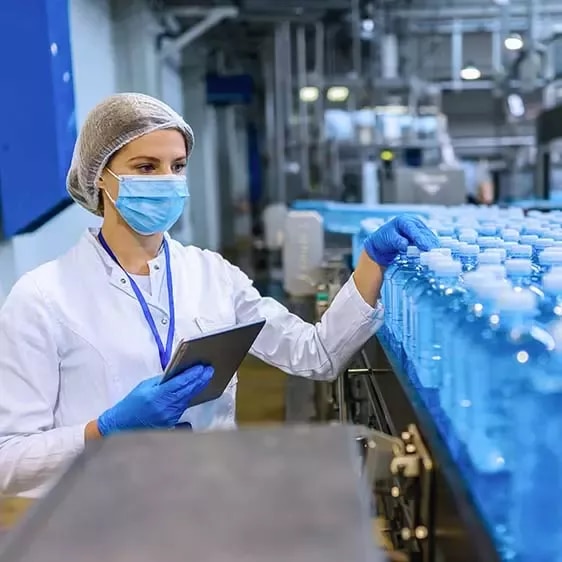 Woman checking water bottles