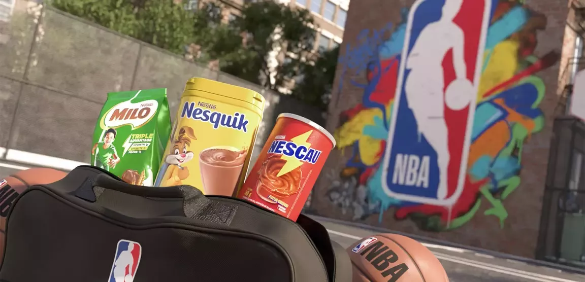 NBA basketball gear displayed with Milo, Nesquik and Nescau products beside an NBA mural