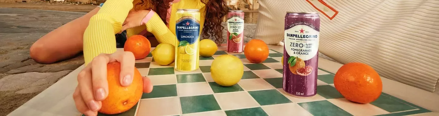 Sanpellegrino sparkling fruit drinks enjoyed outdoors with fresh citrus fruits