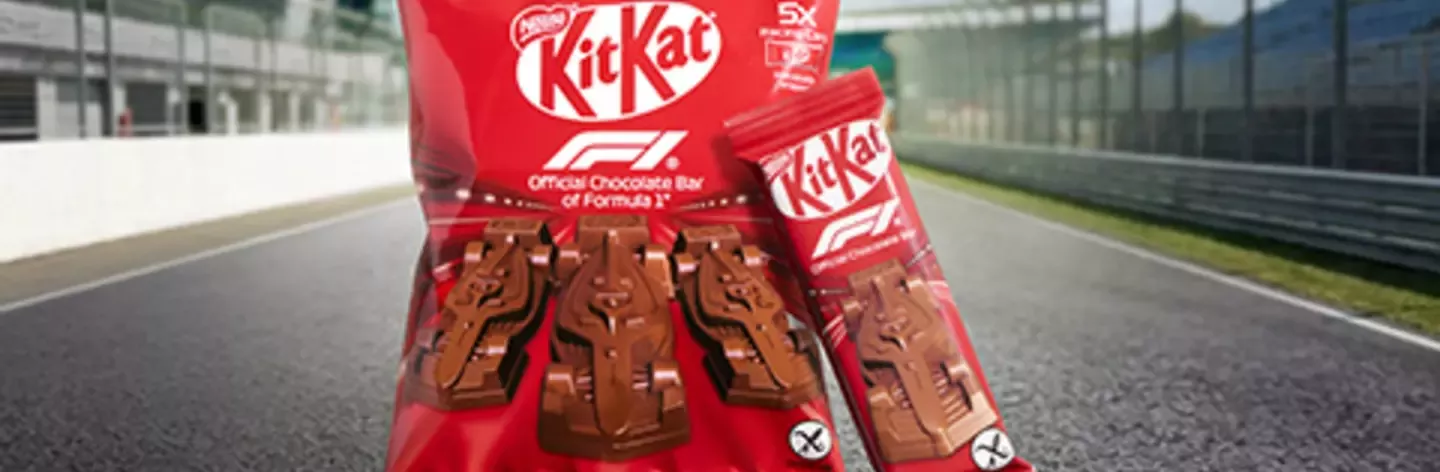 KitKat racing edition chocolate pack displayed on a racetrack finish line