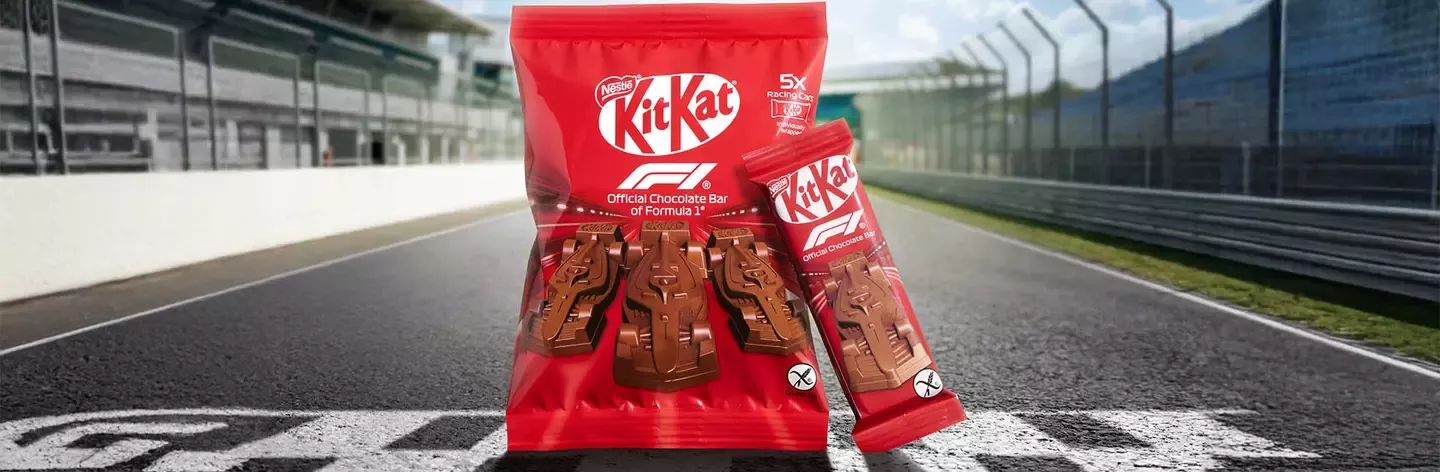KitKat racing edition chocolate pack displayed on a racetrack finish line
