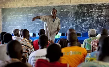 African teacher and students in class