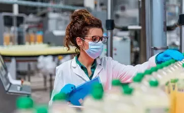 factory working quality checking bottles