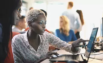 Two women working