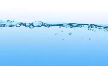 Water surface with bubbles on blue background