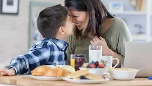Mother and son having breakfast