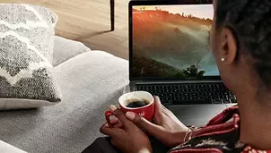 Woman drinks Nescafé coffee at home