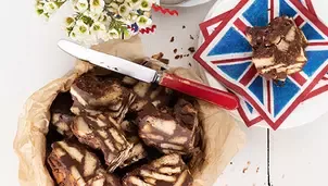 Chocolate biscuit cake slices on parchment paper