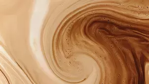 Close-up of coffee crema swirl