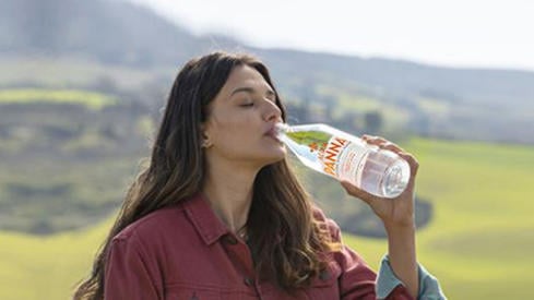woman drinking Acqua Panna